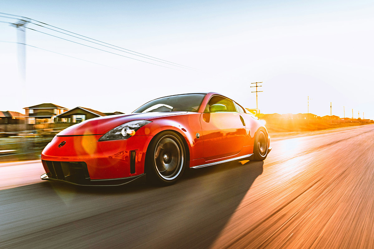 Red Ferrari on road during daytime