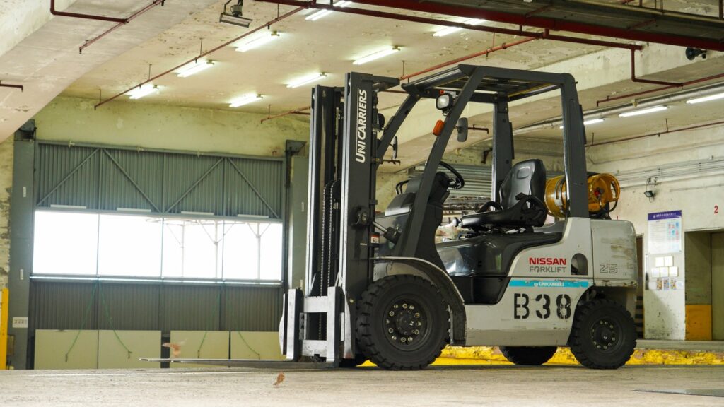 forklift parked inside of a warehouse